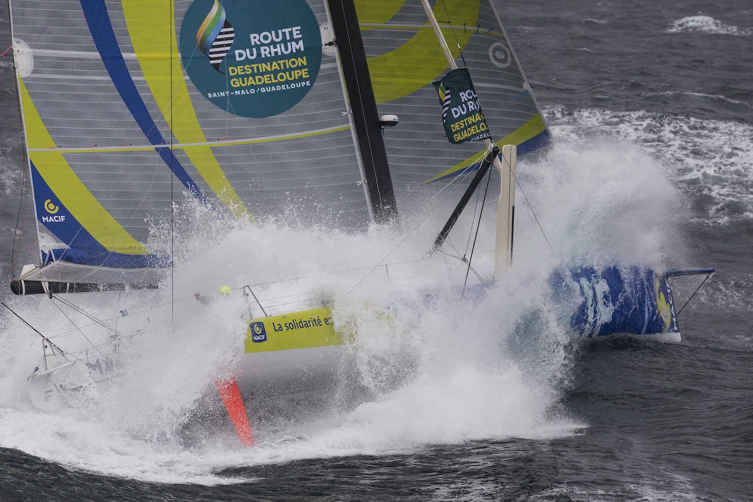 Aerial view of the IMOCA MACIF with french skipper Francois Gabart training in bad weather off Groix Island, south brittany, prior to the Route du Rhum Destination Guadeloupe on october 06, 2014 - Photo Jean Marie Liot / DPPI